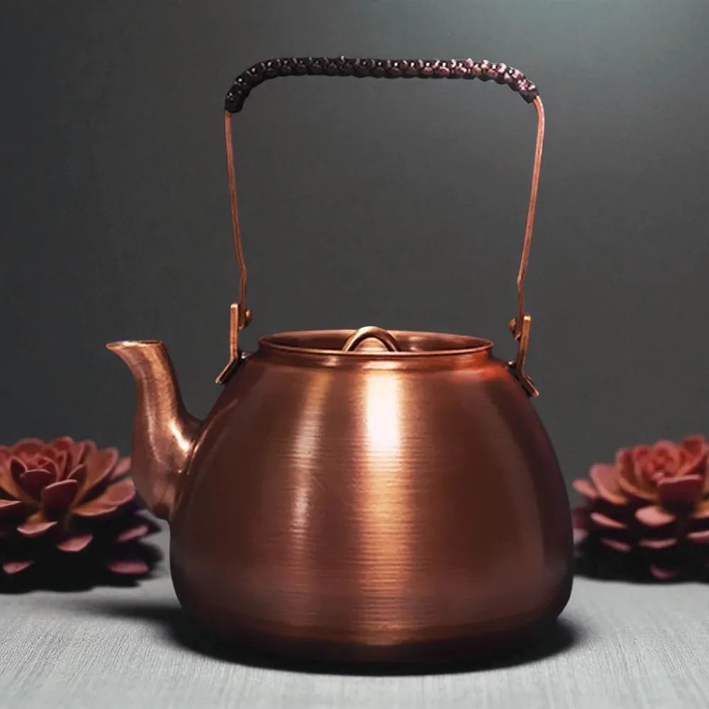 Théière en cuivre violet 1,2L – Artisanale, poêle ronde